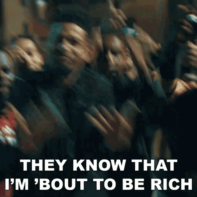 a blurry picture of a crowd of people with the words `` they know that i 'm ' bout to be rich '' .