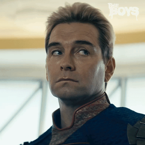 Homelander exhales and looks upward with a resigned expression.