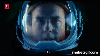 a man in an astronaut 's helmet is looking at the camera and says `` just '' .