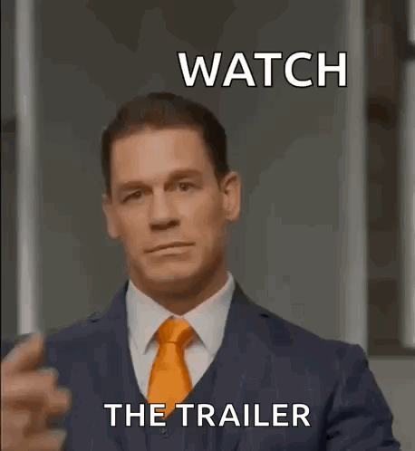 a man in a suit and tie is giving a peace sign .