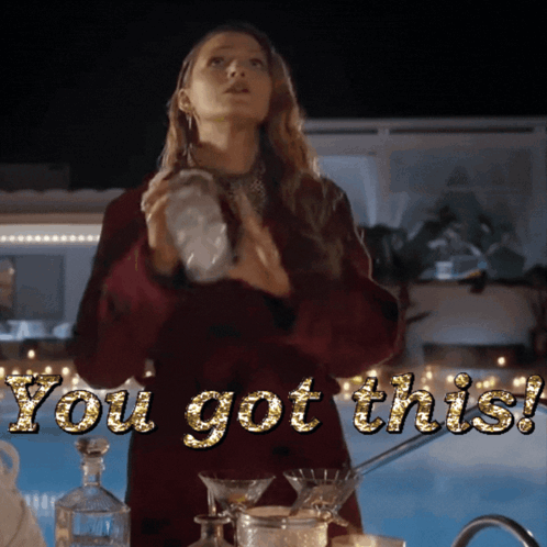 a woman in a red coat is standing in front of a pool with the words " you got this " written on it