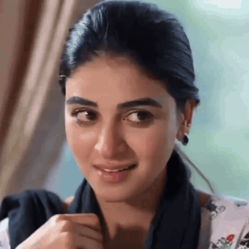 A woman gives a skeptical side-eye with a faint smile.