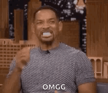 Will Smith claps enthusiastically on a talk-show set, captioned “OMGG.”