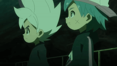 two anime characters are standing next to each other and one has a x on his forehead