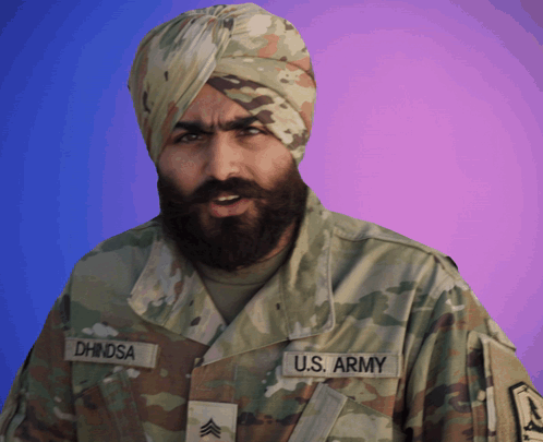 a man in a u.s. army uniform has dhinsa written on his uniform