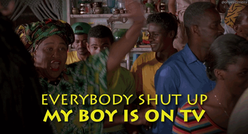 a woman in a green and yellow shirt says everybody shut up my boy is on tv in yellow letters