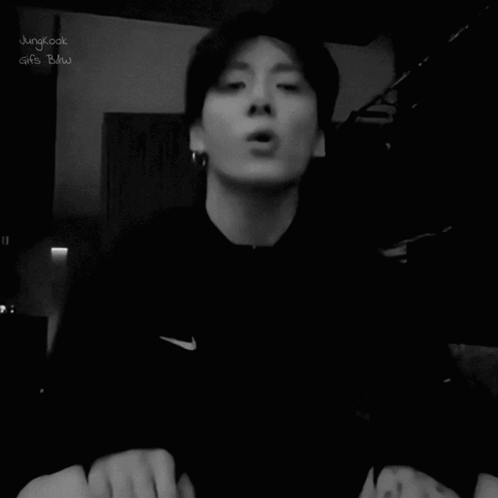 A black-and-white clip shows a man sticking out his tongue at the camera.