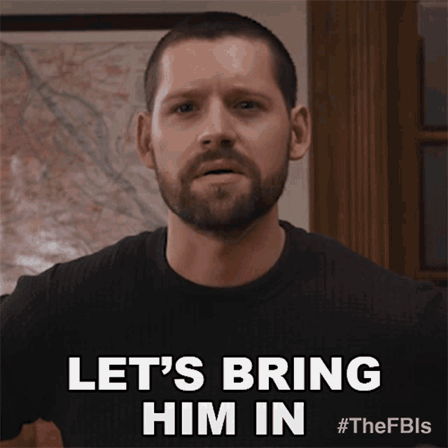 a man with a beard says " let 's bring him in " in front of a map