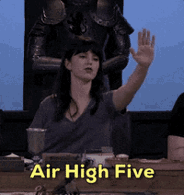 Woman raises a hand in front of a large “Air High Five” caption.