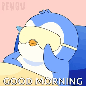 a penguin wearing a sleep mask with the words good morning on the bottom