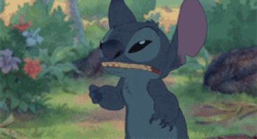 Stitch snarls angrily in an animated forest scene.