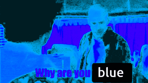 a man stands in front of a blue background with a sign that says why are you blue