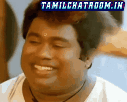a close up of a man 's face with the words tamilchatroom.in above him