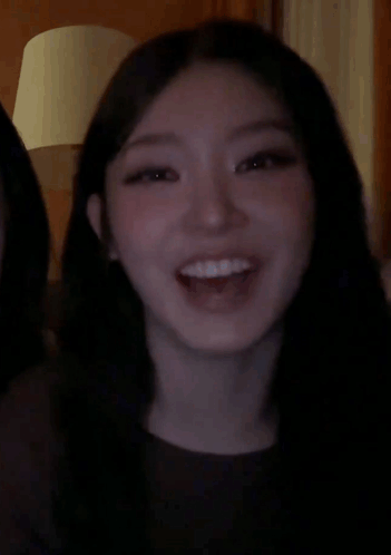 a couple of women covering their mouths with their hands