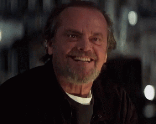 Jack Nicholson smiles and nods approvingly.