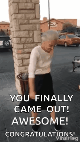 an elderly woman is dancing in front of a brick wall and says `` you finally came out awesome ! ''