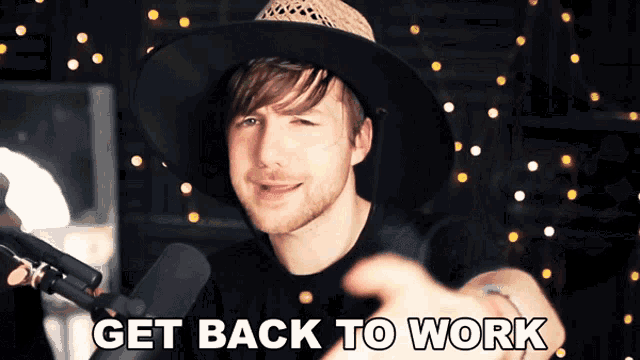 a man wearing a hat is pointing at the camera with the words get back to work below him