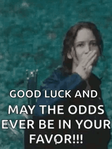 Katniss Everdeen covers her mouth in a teal-toned image captioned “GOOD LUCK AND MAY THE ODDS EVER BE IN YOUR FAVOR!!!”
