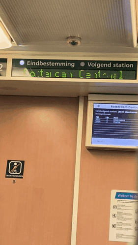 a sign on a train that says ' rotterdam central ' on it