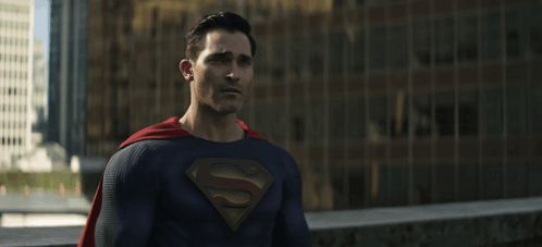 a man in a superman costume with a s on his chest