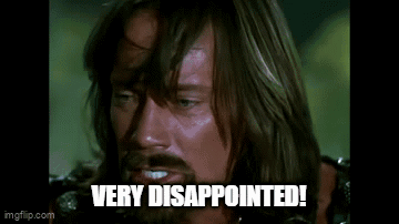 a man with a beard is screaming with his mouth open and the words `` very disappointed '' below him .