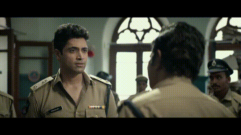 a man in a police uniform has a name tag on his chest that says ' swami '