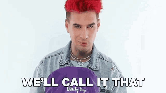 a man with red hair is holding a purple bag and saying we 'll call it that .