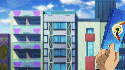 a person is holding a book in front of a city with buildings in the background
