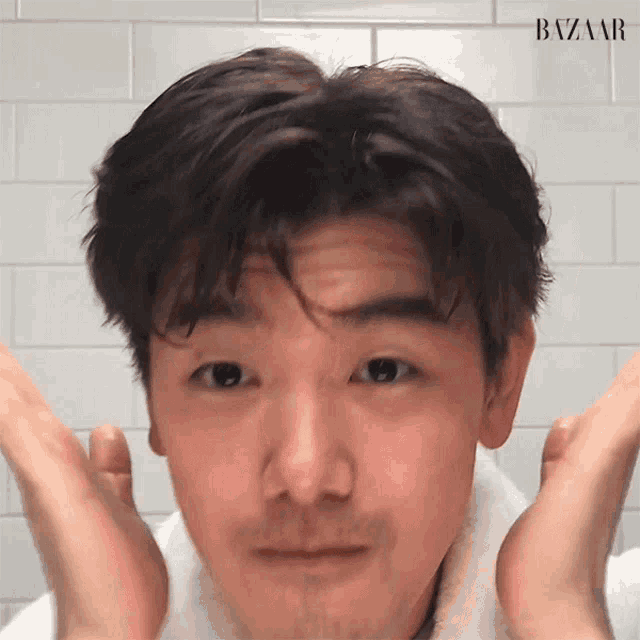 a close up of a man 's face with the words bazaar on the bottom