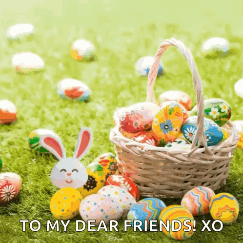 a basket filled with easter eggs and a bunny on the grass with the words to my dear friends ! xo