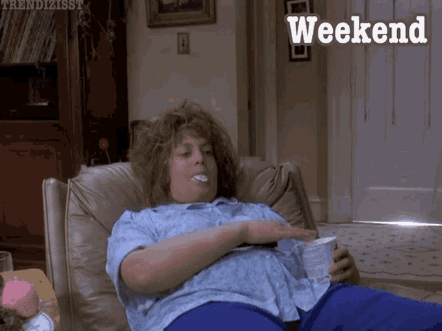 A woman lounges in bed holding a drink with “Weekend” text.