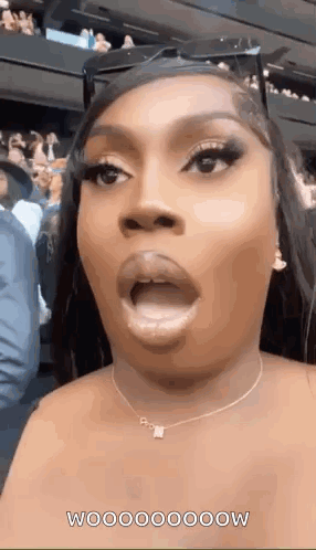 Beyoncé opens her mouth in a wide-eyed surprised reaction.