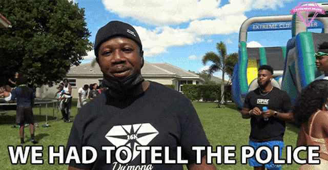 a man wearing a black shirt that says 16k on it