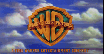 the logo for warner bros. pictures against a blue sky with clouds