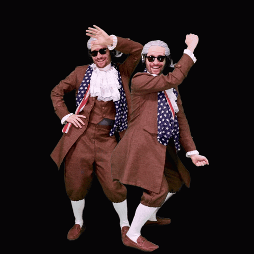 two men dressed up as benjamin franklin are dancing in front of a black background