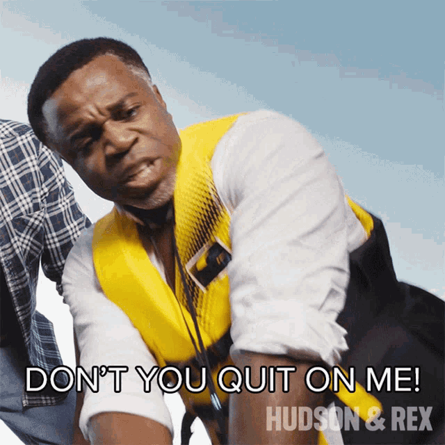 a man wearing a life vest says " don t you quit on me "