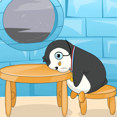 A cartoon penguin droops over a small table in boredom.