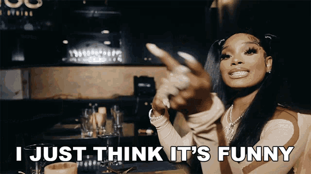 a woman says i just think it 's funny in front of a bar