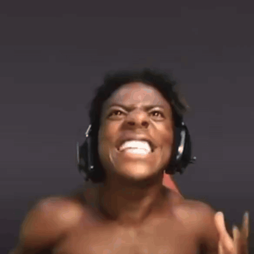 a shirtless man is wearing headphones while sitting in a chair .