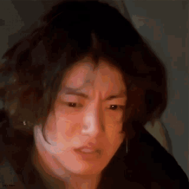 A blurry close-up shows a man making a confused, displeased face.