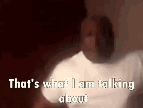 A man in a dim room is captioned “That's what I am talking about.”