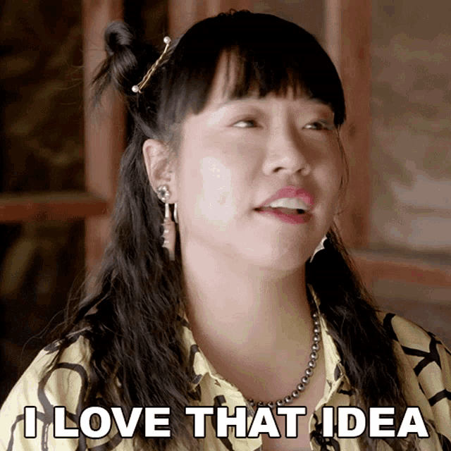 a woman says " i love that idea " in front of a window