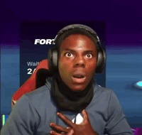 A streamer clutches his chest with wide eyes in alarm.