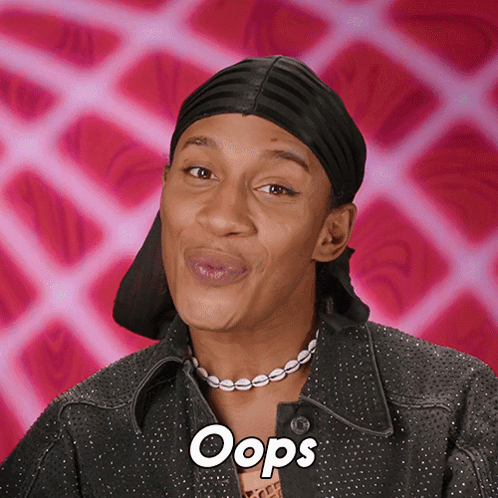 A person in a black headwrap smiles knowingly against a pink patterned background with “Oops.”