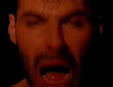 a man with his mouth open and his tongue out