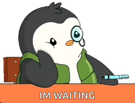 a cartoon penguin is sitting at a desk with the words im waiting below him