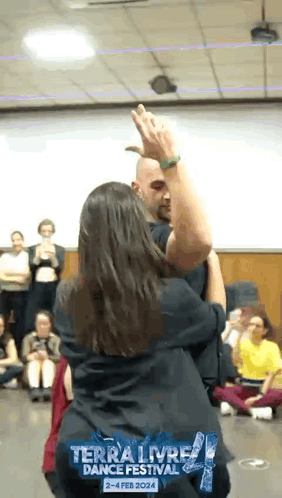 a man and a woman are dancing at the terra livre dance festival in february