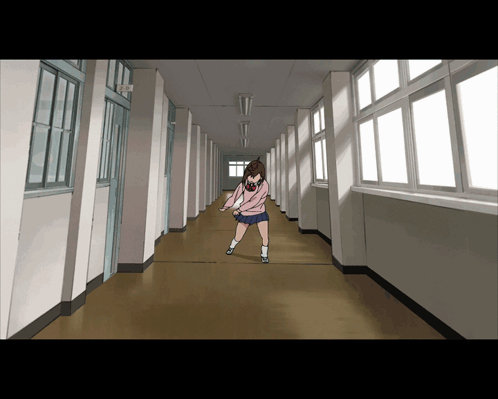 a girl in a pink sweater is walking down a hallway
