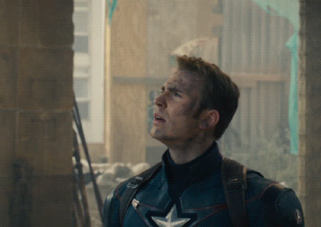 a man in a captain america uniform is looking up