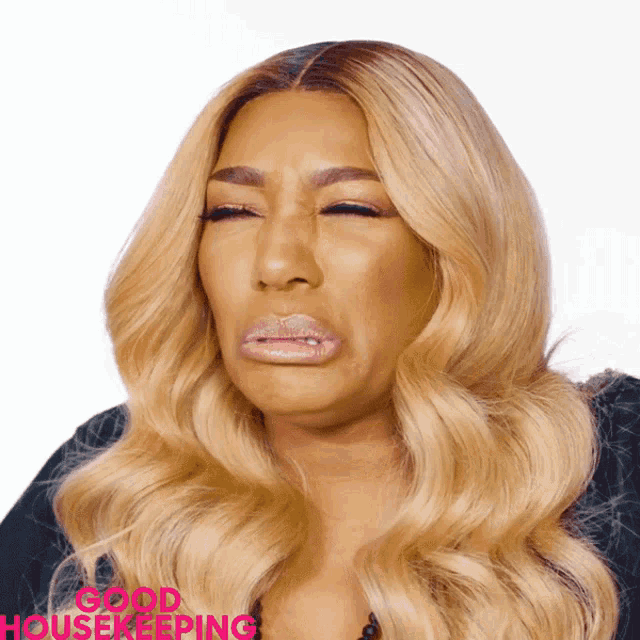 a woman with her eyes closed and the words good housekeeping on the bottom right